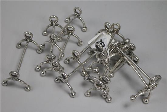 Six pairs of Christofle knife rests